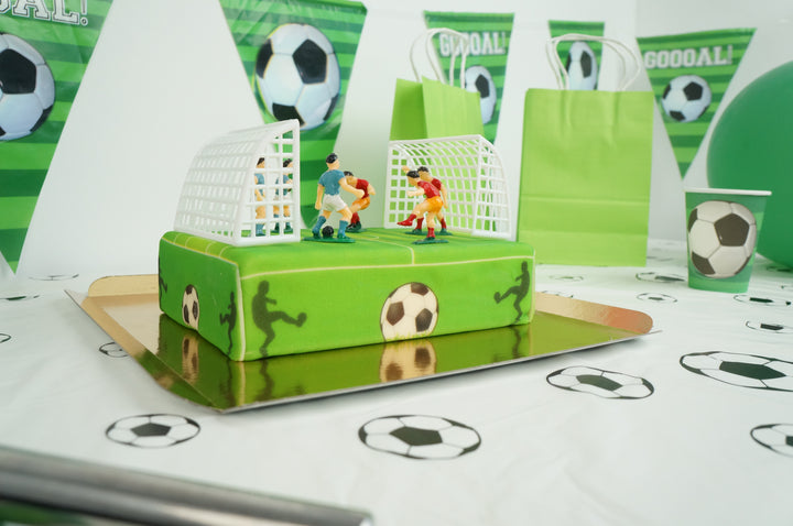 Voetballer op voetbalveldtaart