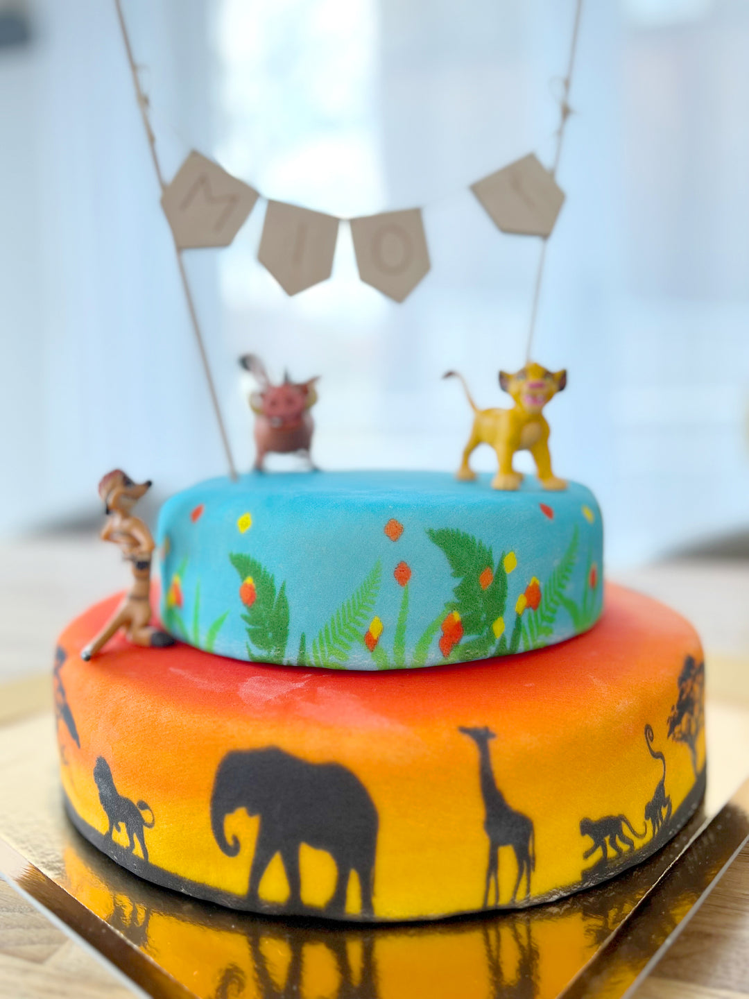 Simba®, Timon® en Pumba®, twee-verdiepingen savanne taart 